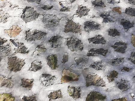 Stacked rocks and cement wall texture background with shadow for constructionの写真素材