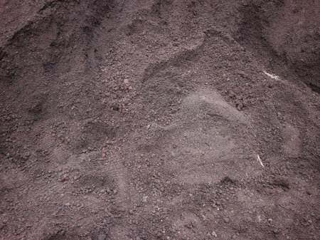 Pile of dark sand or soil for constructionの写真素材
