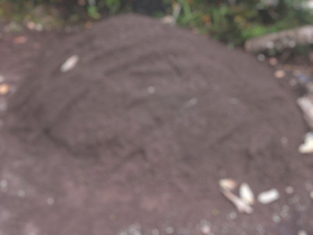 Defocus pile of dark sand or soil for constructionの写真素材