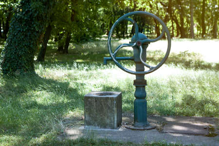 Old style green water well and pump for water
の写真素材