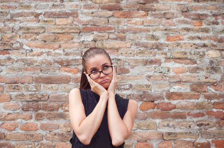 Young beautiful woman with bored empty expression background