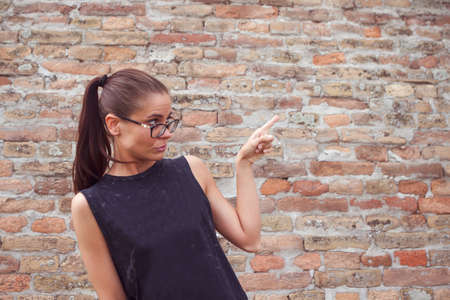 beauty woman pointing to the side at copy spaceの写真素材