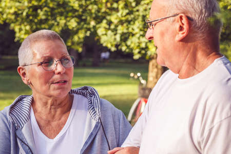 Senior couple enjoying walk in park togetherの写真素材