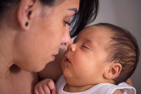 mother and her newborn baby boy, family, parents, love, maternity concept,の写真素材
