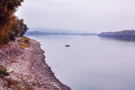 Autumn river water landscape. Forest river in autumn season. Autumn forest river water. Autumn river...