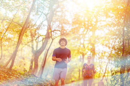 running - Young Couple jogging and running outdoors in nature
