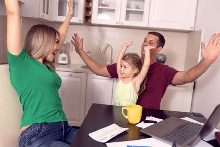 Young family having fun together at homeの写真素材
