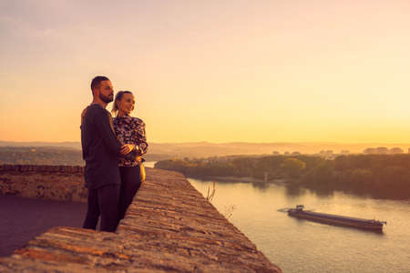 Lovers. romantic at sunset. Happy couple smiling and enjoying togetherの写真素材