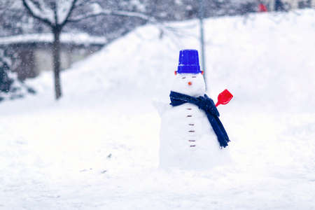 snowman in winter. Winter scene with smiling snowman on white snow background. Happy winter time. Snowman. の写真素材