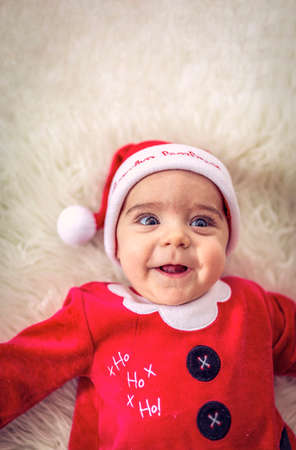Smiling Baby boy  in santa claus costume.Cute Santa claus Baby boy on Christmas dayの写真素材