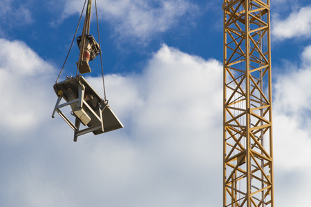 Construction Area with crane during weekend with white cloudsの写真素材