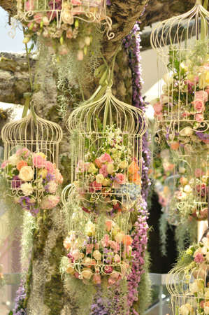 Decoration of colorful flower in cageの写真素材