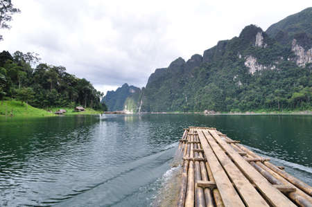 Bamboo raft heading on lake in Kho Sok national park, Thailand