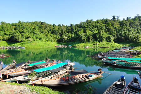 Group of long tailed taxi boat floating on lake waiting for customer