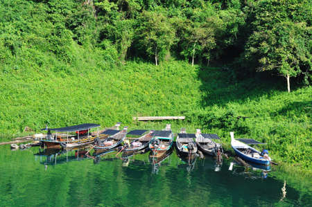 Group of long tailed boat floating on lake