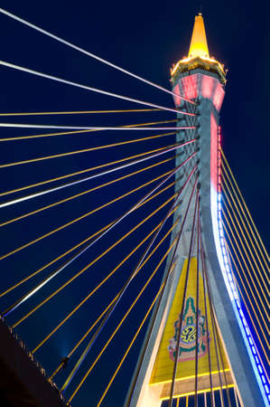 Symbol of king rama 9 on bridge in twilightの写真素材