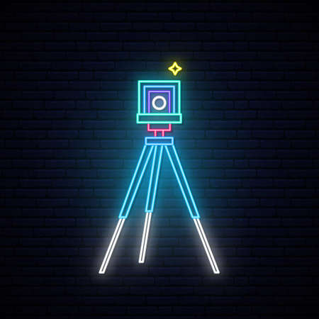 Neon Photo camera sign. Retro photo camera on tripod. Bright light signboard. Vector illustration in neon style.のイラスト素材