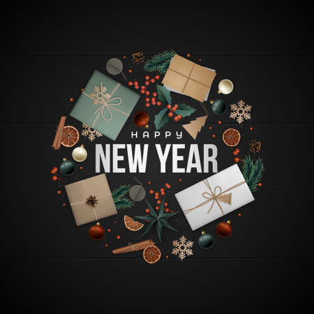 New Year greeting card. Flat lay composition. Christmas elements laid out in circle shape on black wood floor. Scandi style.の写真素材