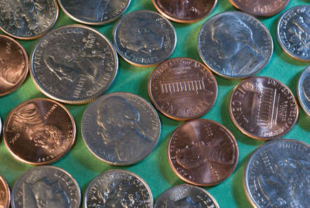 a pattern of coins spread out on a flat surfaceの写真素材