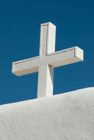 Cross on top of the wall surrounding the plaza of the St. Jerome Church, Taos Pueblo, New Mexicoの写真素材