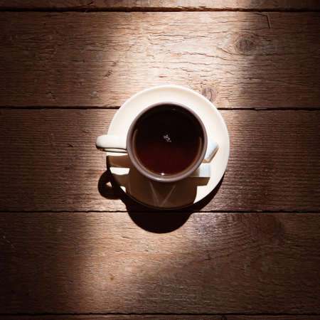 Cup of tea with sugar on brown rustic surfaceの写真素材