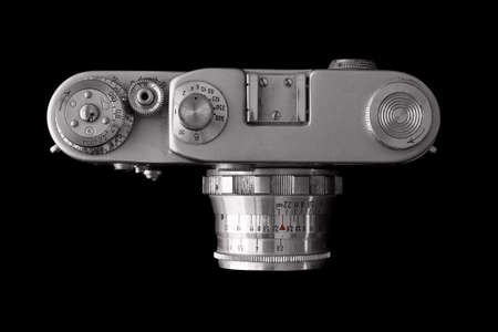Top view of retro camera isolated on black