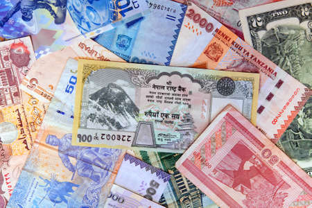 Various denomination of foreign exotic currency notesの写真素材