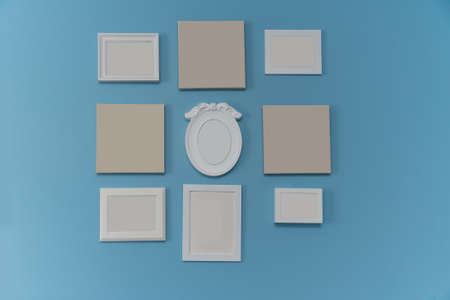 Various picture frames hang on blue wall