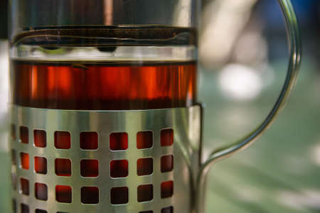 Close-up photo of french press teapot with teaの写真素材