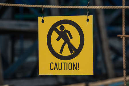 Caution sign at a construction site warns visitors of area Caution sign at a construction site warns visitors of area
