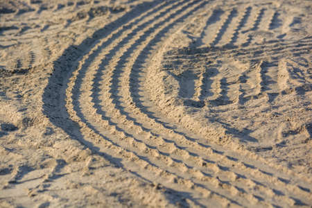 Background made of tyre tracks on the sandの写真素材