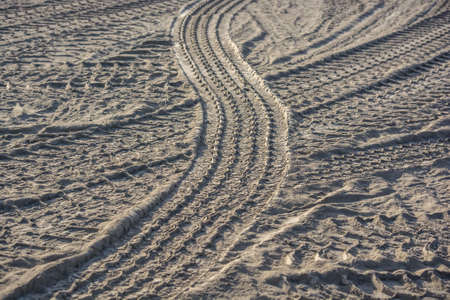Background made of tyre tracks on the sandの写真素材