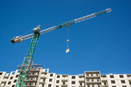 Construction of the new moden residential buildings and craneの写真素材