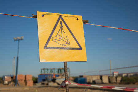 Caution sign at a construction site warns visitors of areaの写真素材