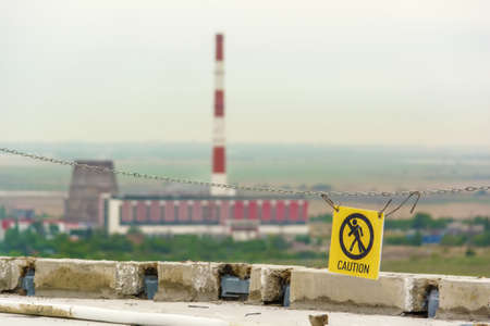 Caution sign at a construction site warns visitors of areaの写真素材