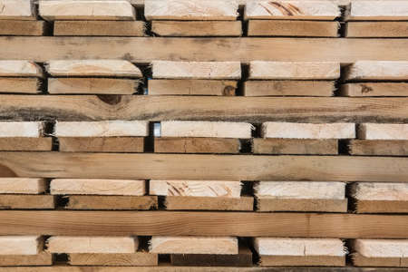 Planks of processed timber packed in blocksの写真素材