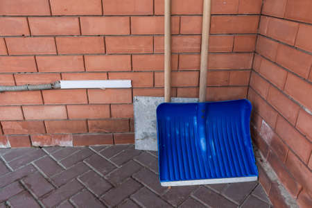 Snow shovels at house yardの写真素材