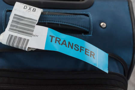 Close up photograph of luggage with transfer labelの写真素材
