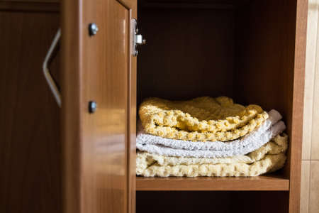 Fragment of a home wardrobe with towelsの写真素材