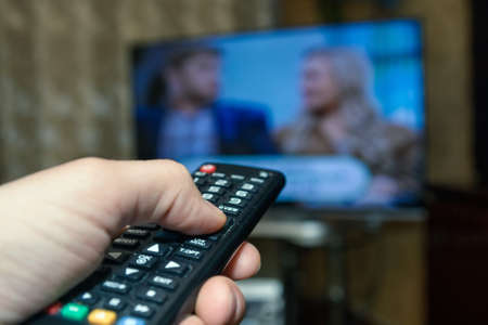 Watching TV and using remote controller