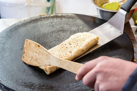 Cooking pancake outdoorsの写真素材