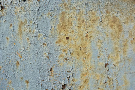 Blue cracked painting on metal surface