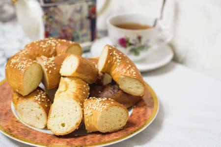 Close up of cut bagels with sesame and poppy seedの写真素材