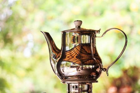 Shiny steel metal teapotの写真素材