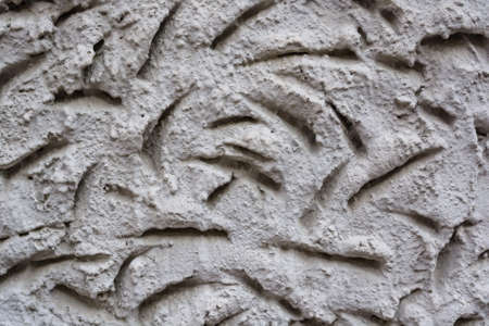 Closeup uneven plaster texture backgroundの写真素材