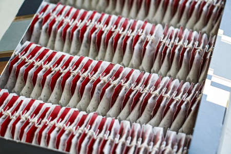 Close up tea bags with red labels in boxの写真素材