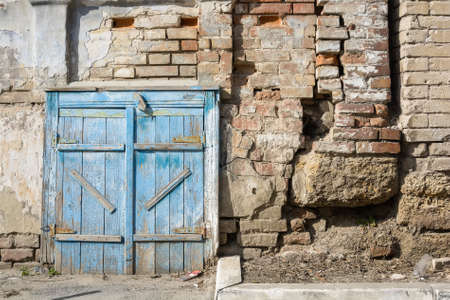 Old barn door painted blueの写真素材