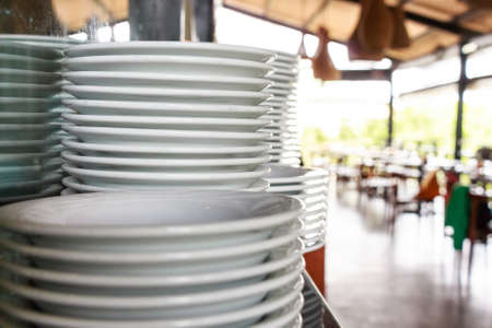 Stack of clean white ceramics platesの写真素材