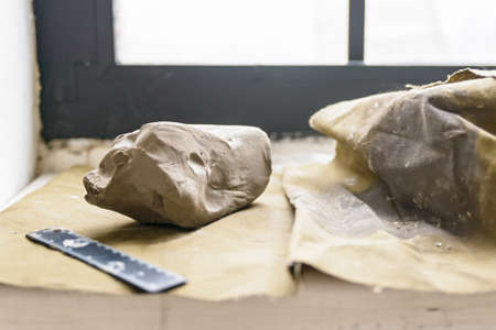 Piece of white clay for sculpting close upの写真素材