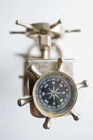 Close up small vintage compass in shape of steer